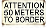 "50 Meters to Border" Vintage Metal Sign